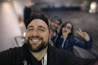 a group of people taking a selfie at an event